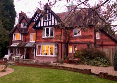 English Home with fired clay siding and a traditional roof.